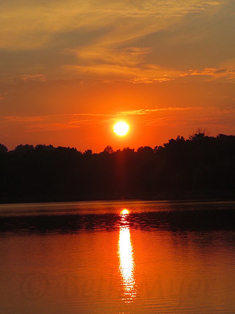 Orange Sunset Over Water Vertical View
